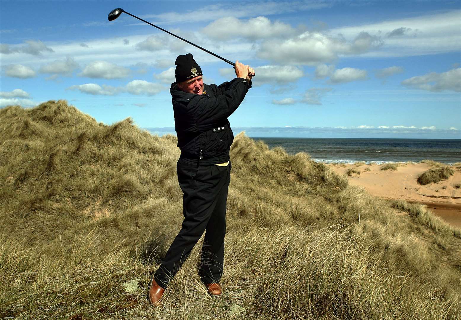 Donald Trump visited the beach where he planned to build a £300 million golf course at Menie Estate near Aberdeen in April 2006 (David Cheskin/PA)