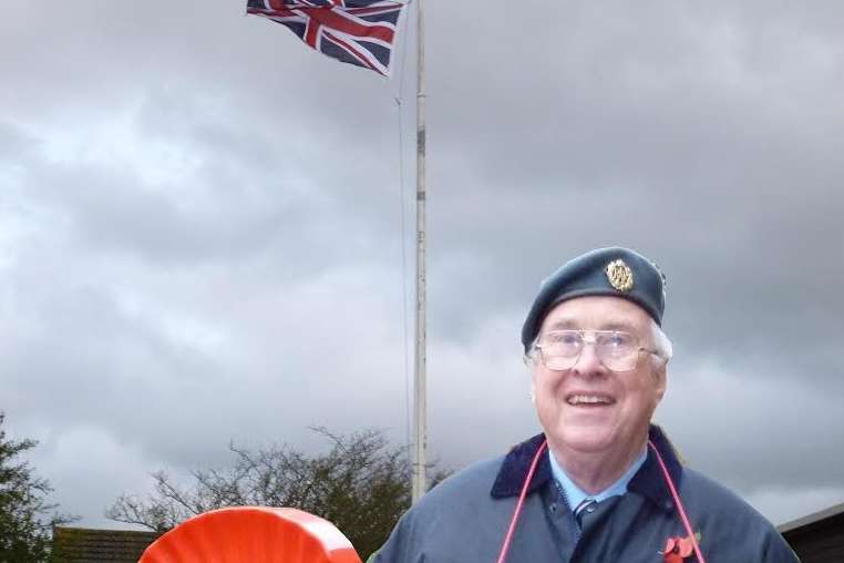 Ray Chopping in front of the new flag outside Borough Green library