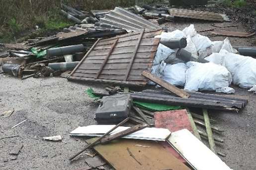 Munitions and asbestos slung on a road in Dunkirk.