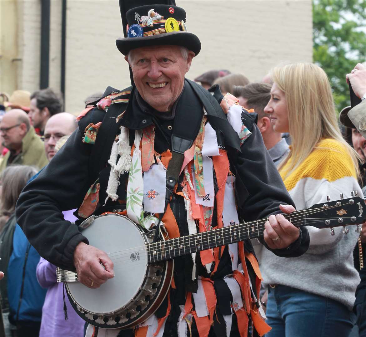 Morris dancers in a long procession through Rochester High Street at The Sweeps Festival in Rochester. Picture by: John Westhrop (9744830)