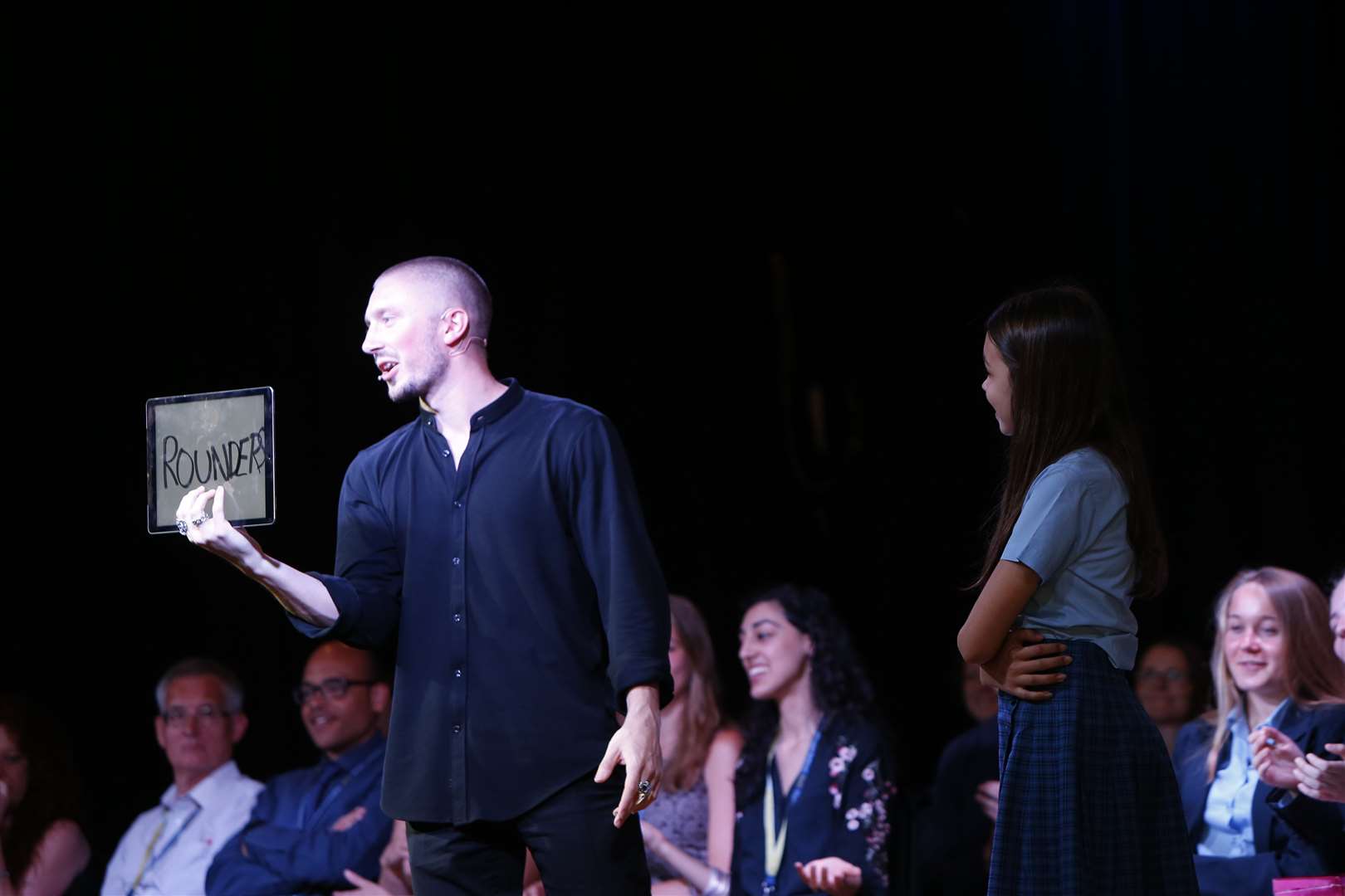 Tom London performs at the end of year assembly with pupil Rosie Williams at Highworth Grammar School. Picture: Andy Jones