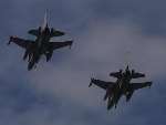 The two F-16s zoom over Staplehurst station. Picture: JOHN WESTHROP