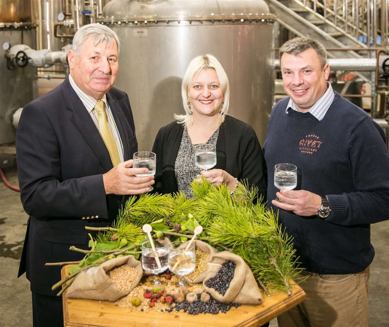 Bob and Matthew Russell with Gemma Wright of Castle at the distillery Picture: www.matthewwalkerphotography.com