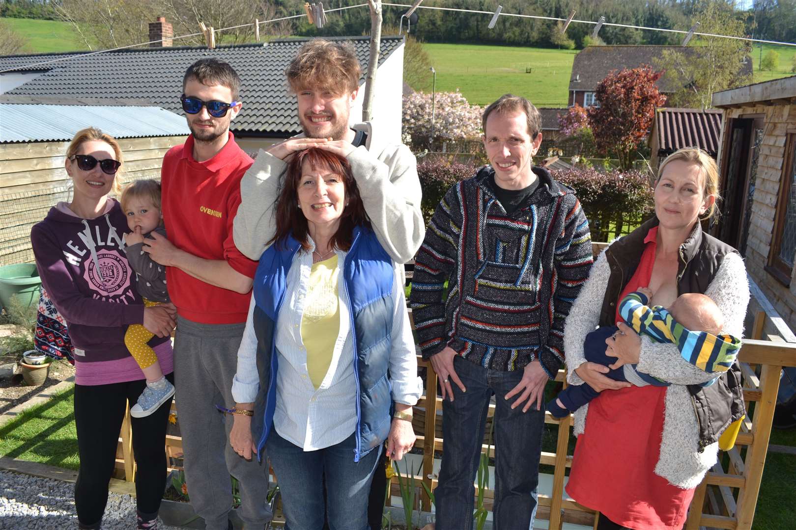 Rebecca (right) holding her baby with her mother Lyn (centre) and siblings, Kate (left), Jacob, Jordan and Daniel. Picture: Lyn Richardson