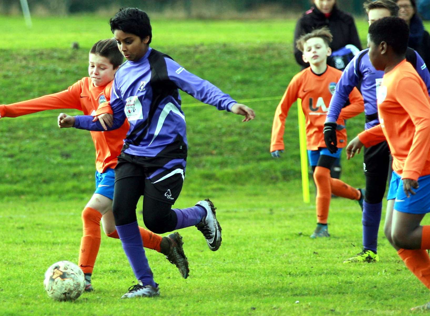 Anchorians (purple) do battle with Cuxton 91 Falcons in the Under-11 Emerald Division Picture: Phil Lee