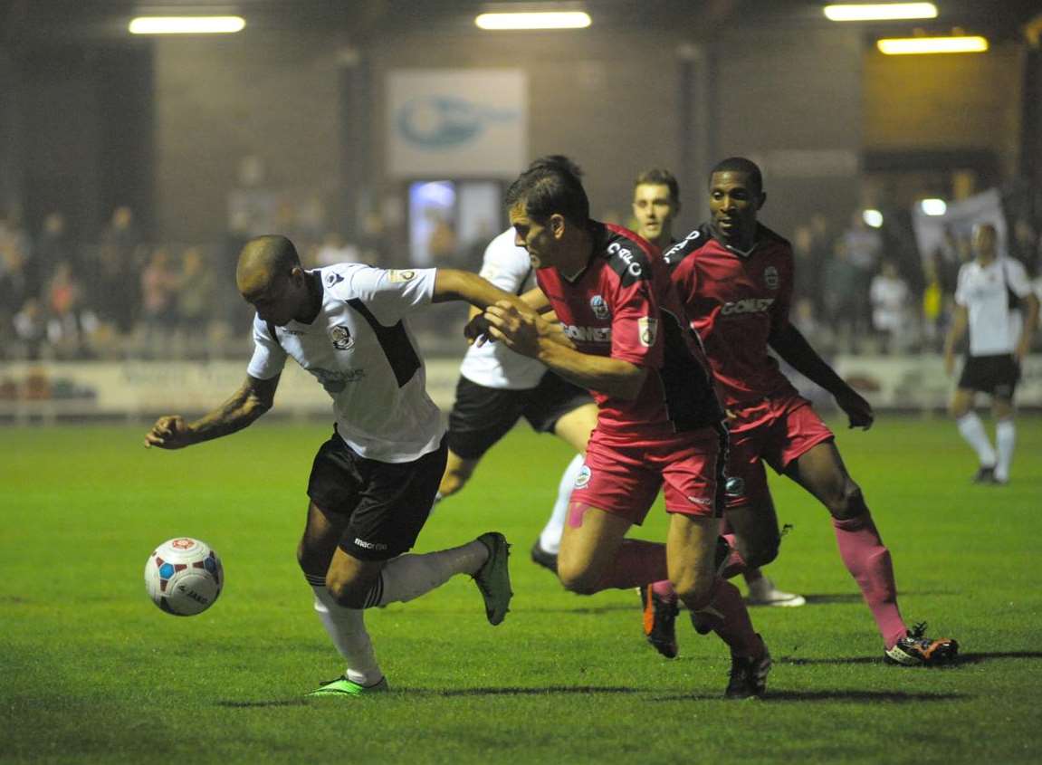 Luke Daley is kept in check by former Dartford defender Tom Bonner Picture: Steve Crispe