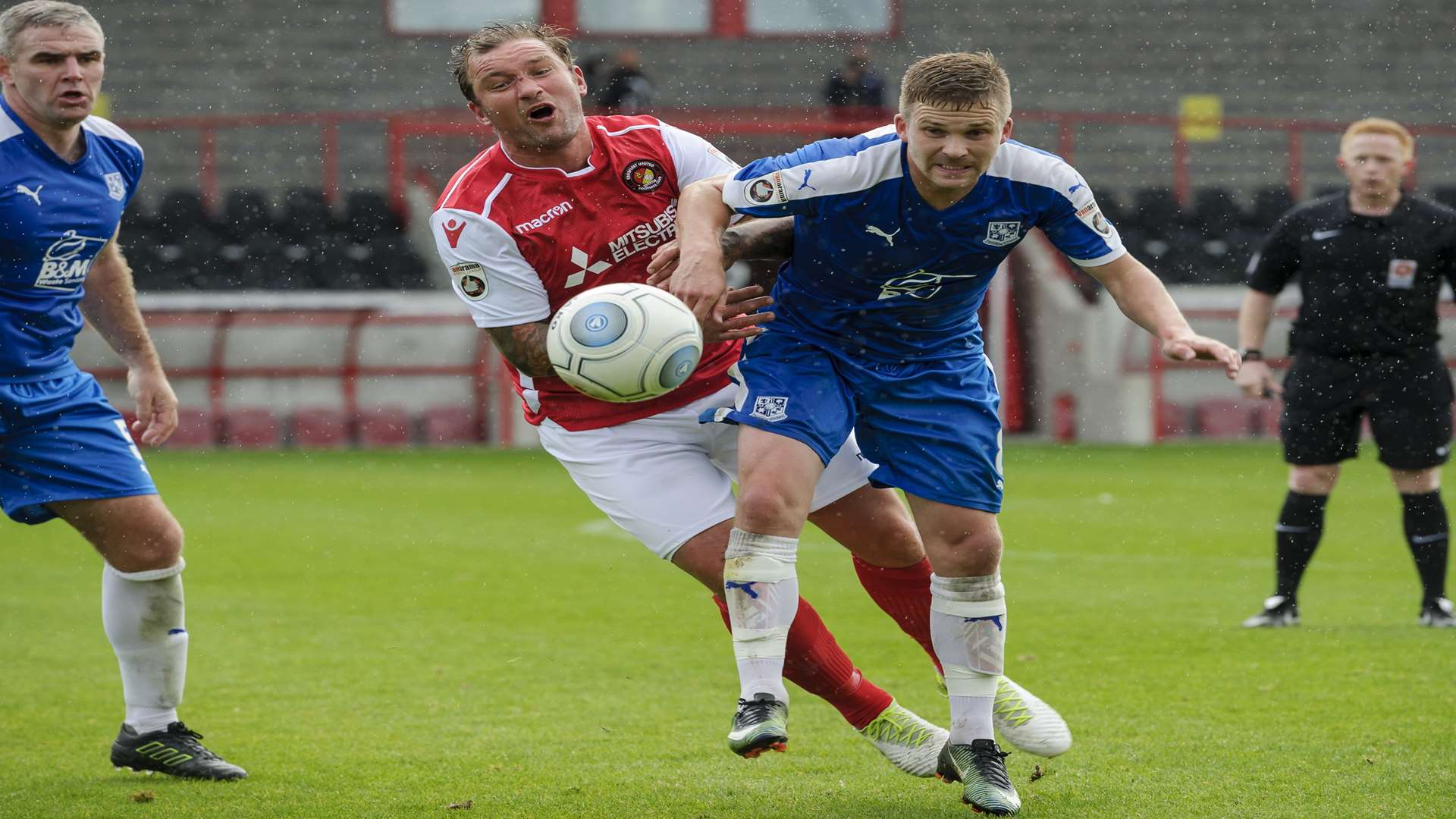 Danny Kedwell knocked off the ball by Tranmere's Jay Harris Picture: Andy Payton