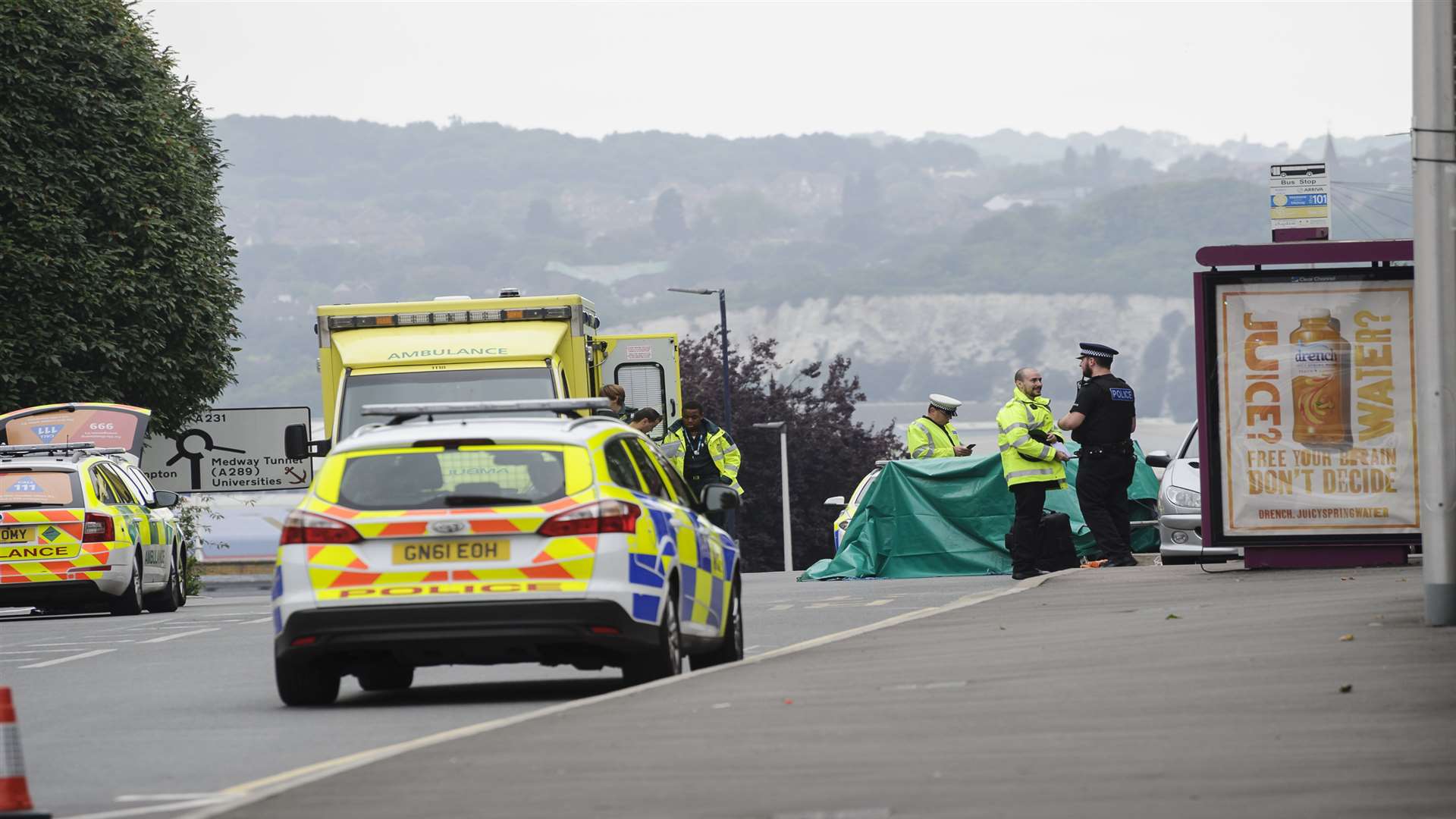 A green tent was erected around the man's body.