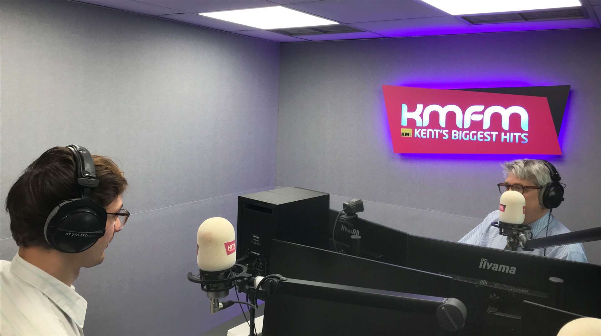 Daniel Esson and Simon Finlay recording the Kent Politics Podcast in the kmfm studio