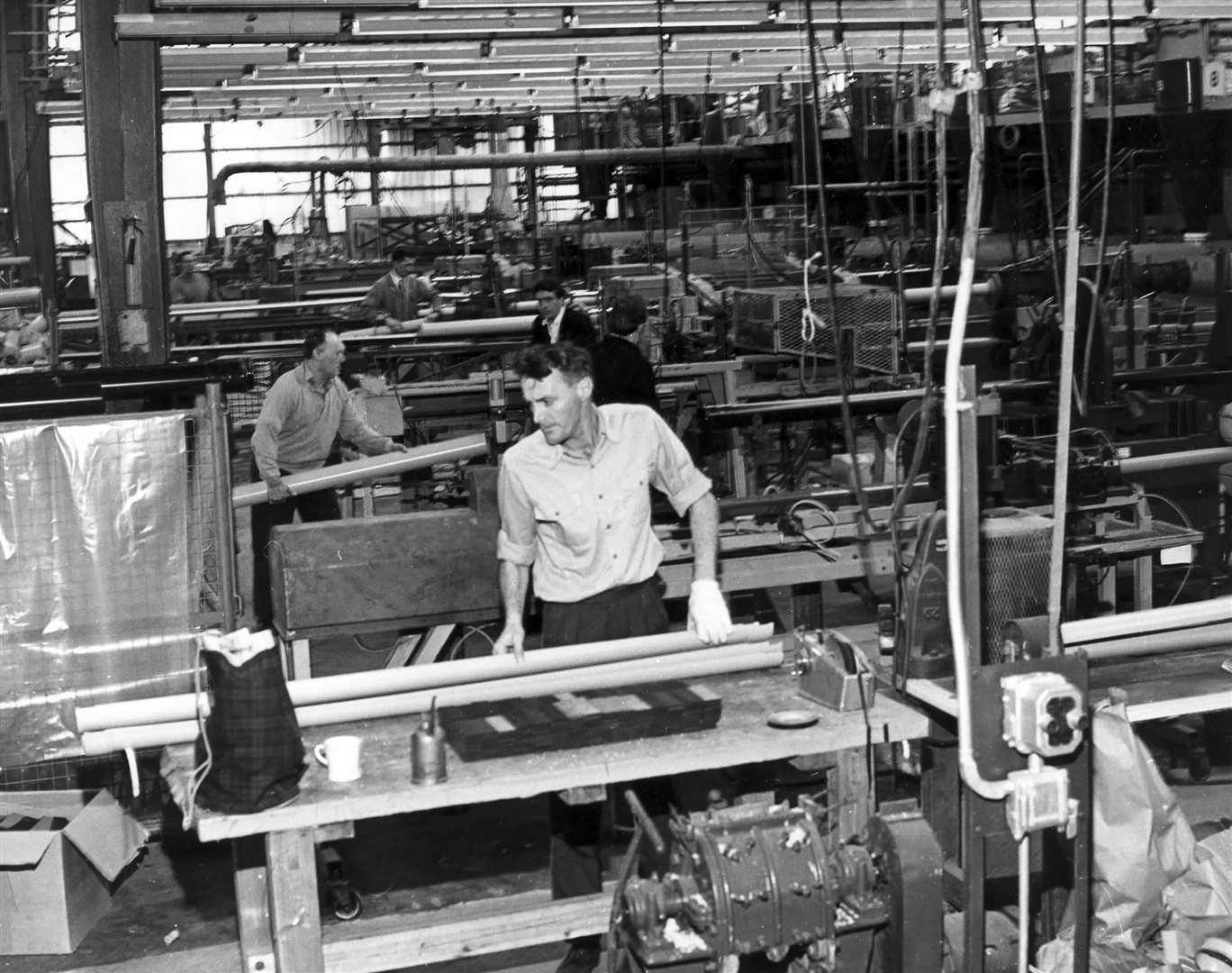 Workers producing lengths of gullies and drainpipes at Marley Tile Co. Ltd in 1966