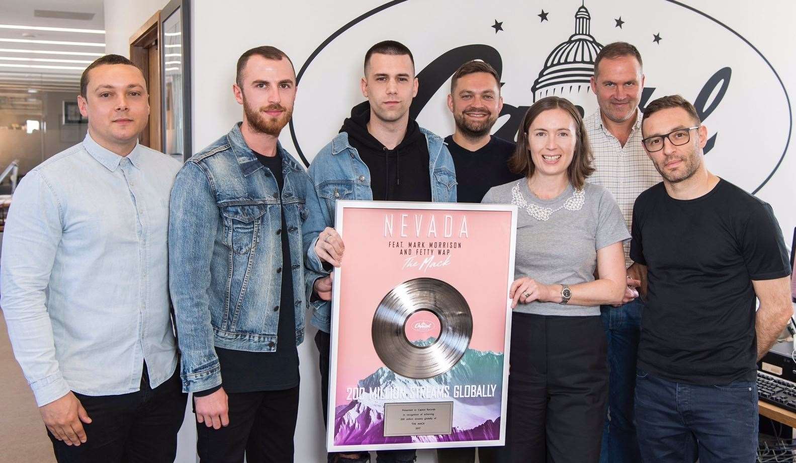 aniel Stephenson (far left) with Nevada (third from the left) with their plaque for The Mack