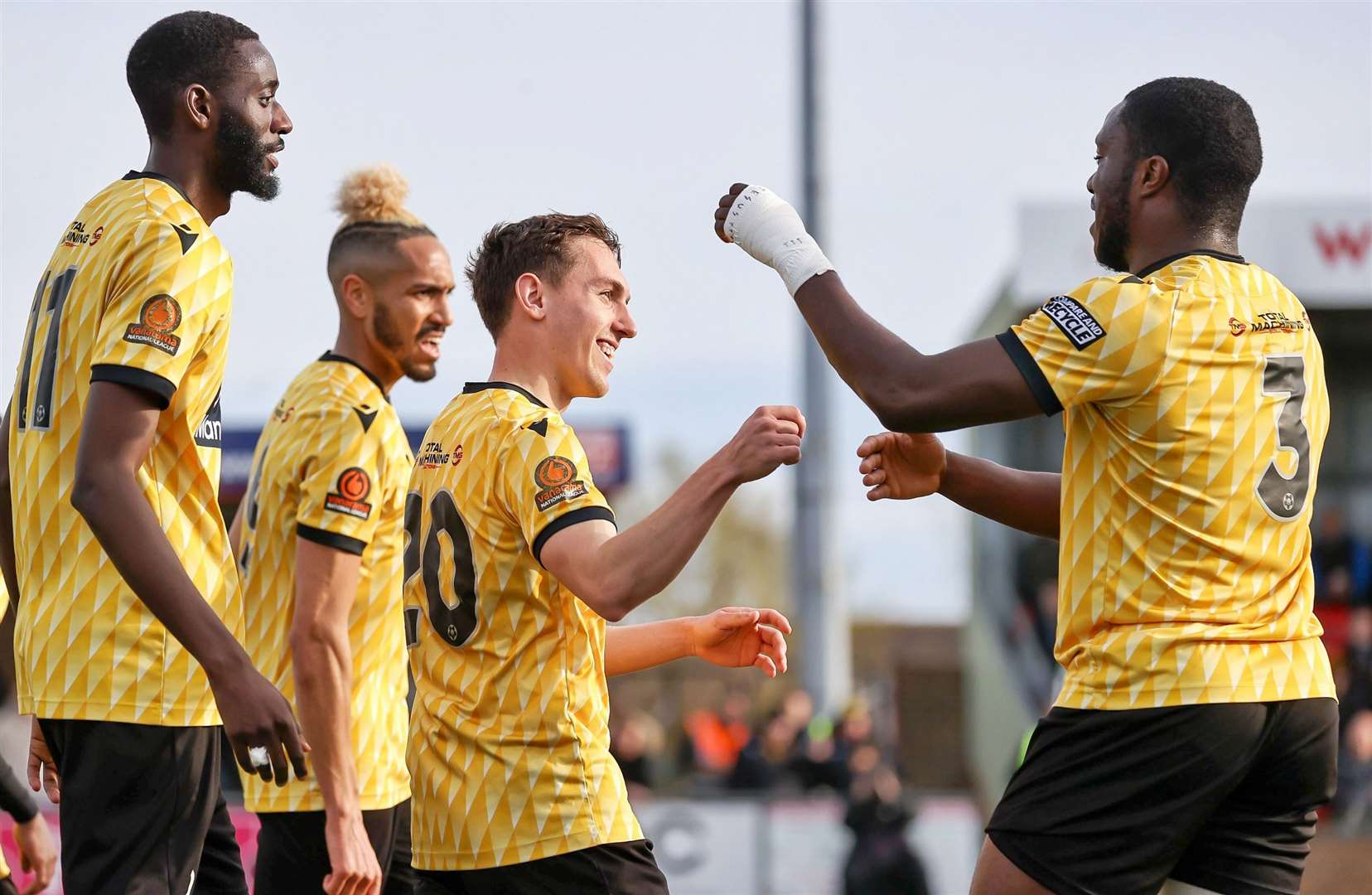 Matt Rush, centre, celebrates his goal with Stones team-mates. Picture: Helen Cooper