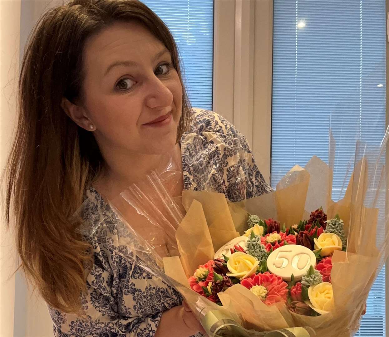 Shauna Cook, from Sittingbourne, makes floral arrangements out of cake. Picture: SWNS