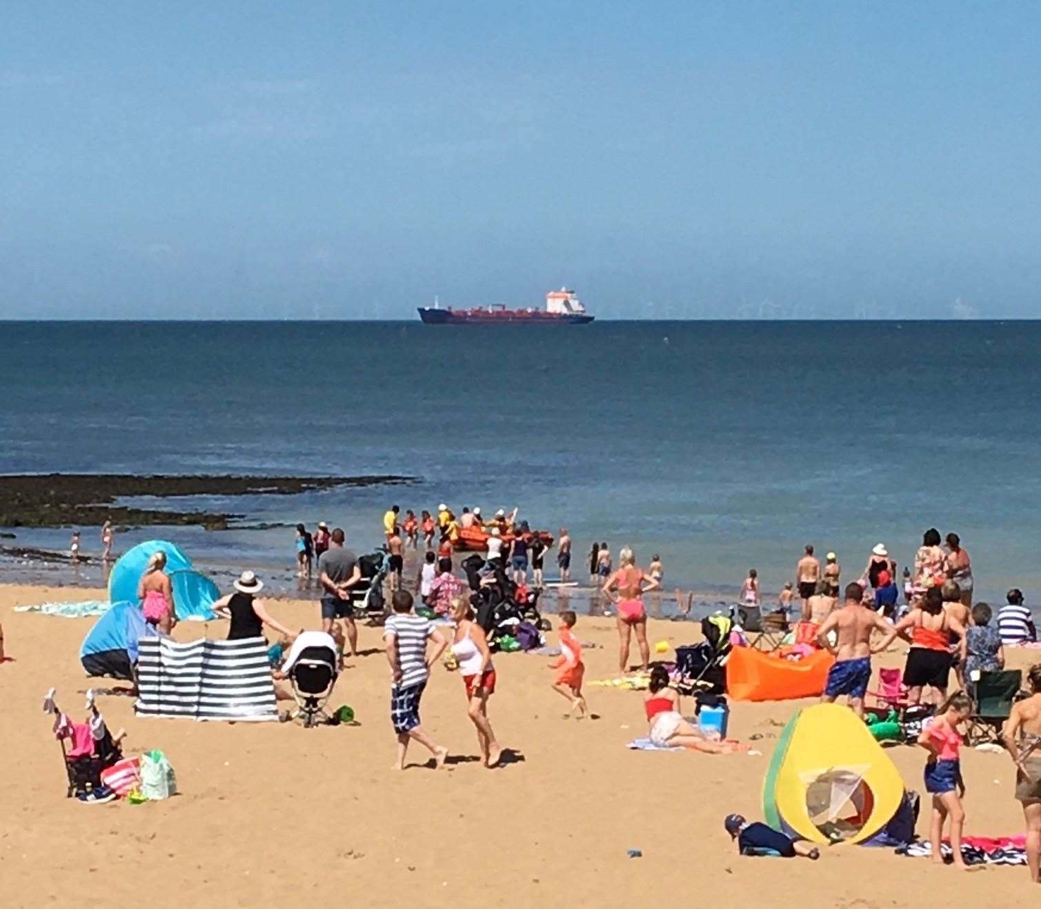 The moment the girls are brought ashore by the lifeboat at Botany Bay. Picture: RNLI (14803226)