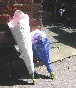 Floral tributes left outside Faversham police station in tribute to Matthew Sheldon