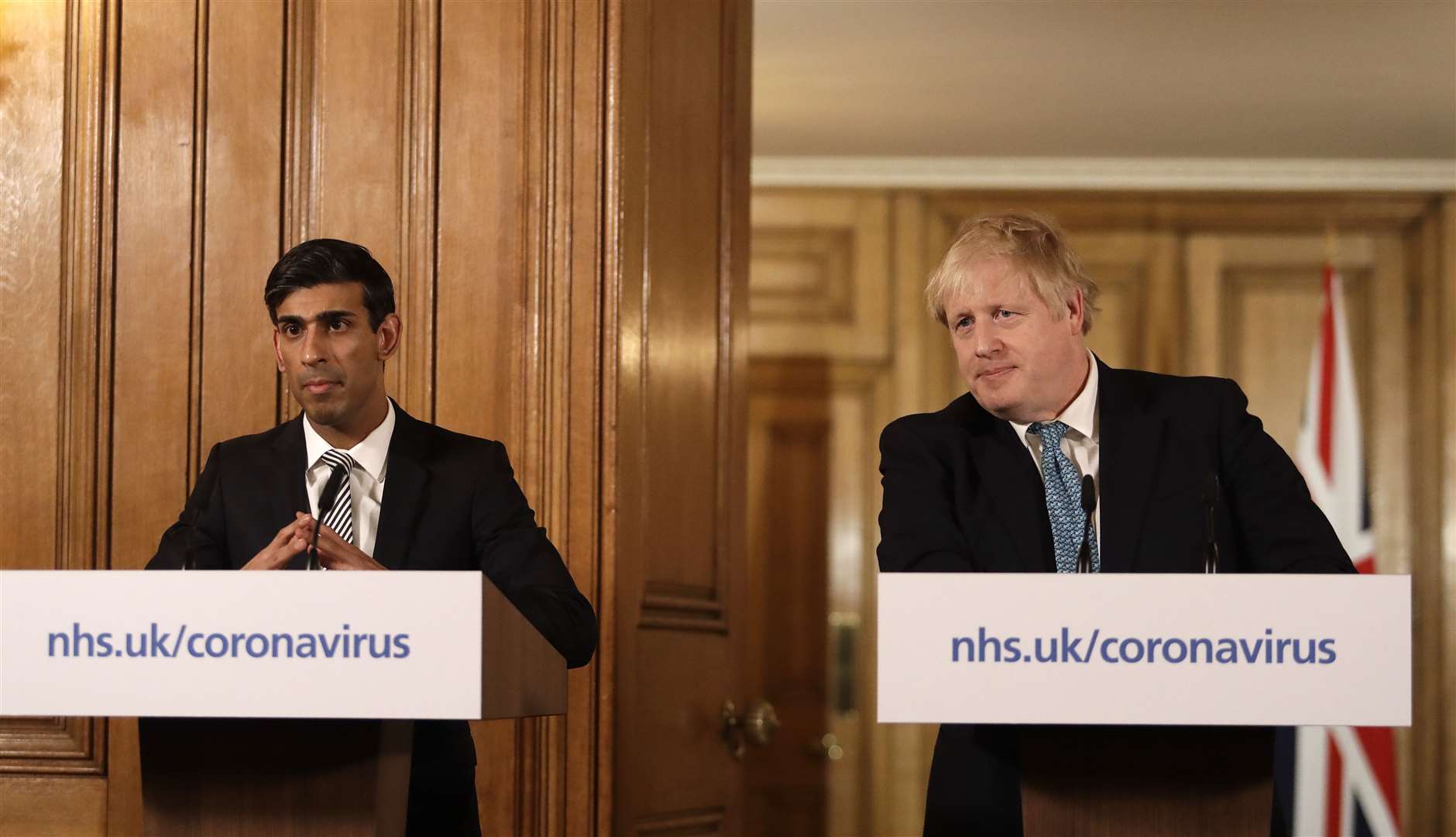 Chancellor Rishi Sunak with Prime Minister Boris Johnson during a media briefing in Downing Street (Matt Dunham/PA)