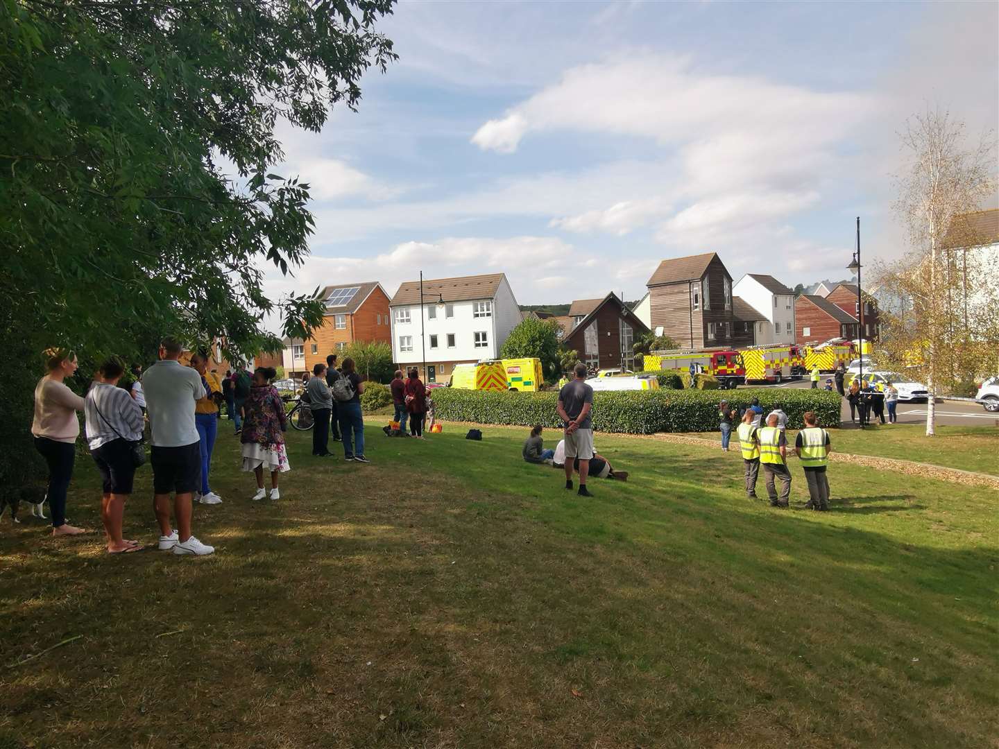 Nearby residents look on as emergency crews deal with the blaze in St Mary's Island