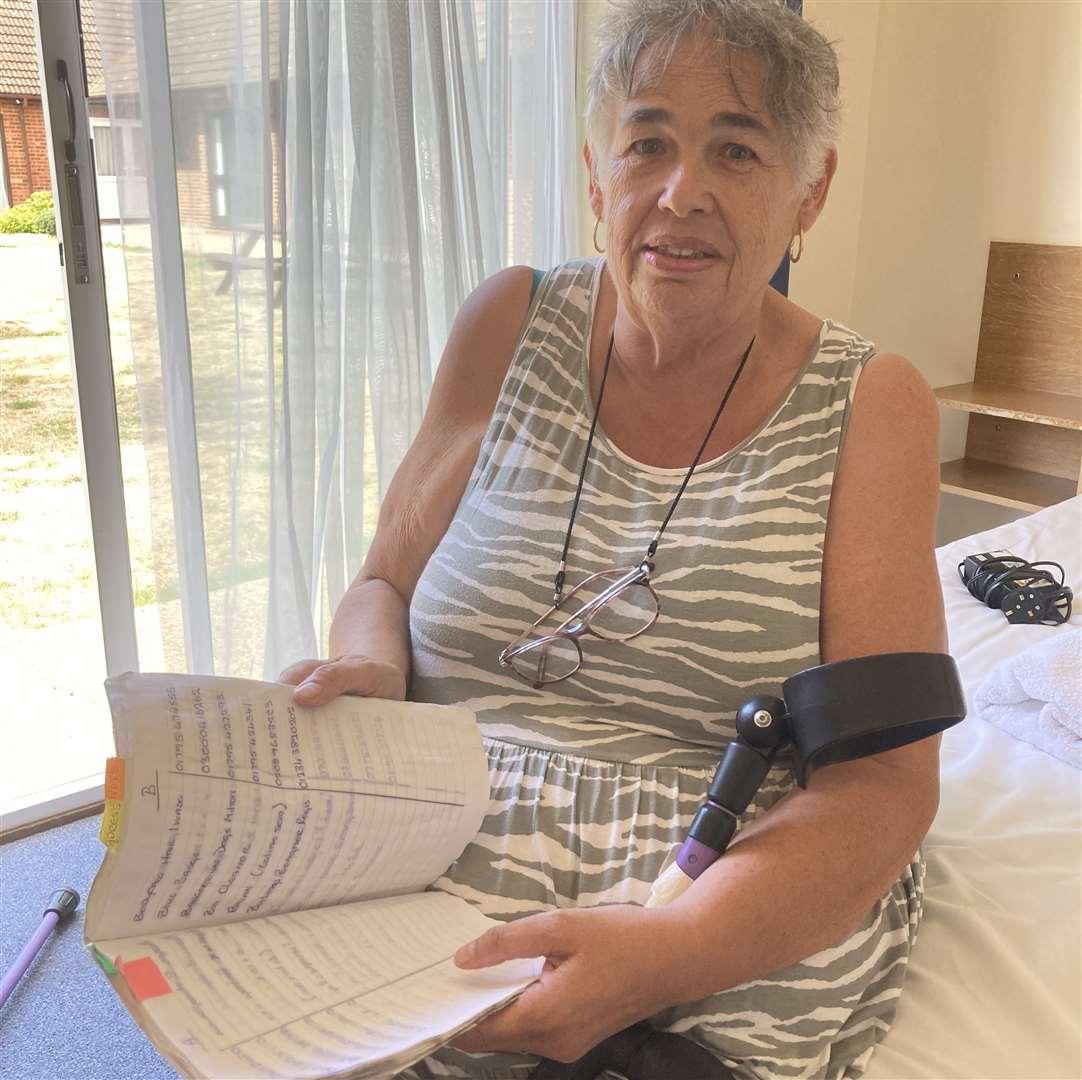 Deirdre O'Neil with her address book - the only thing saved when fire destroyed her bungalow. Picture: John Nurden