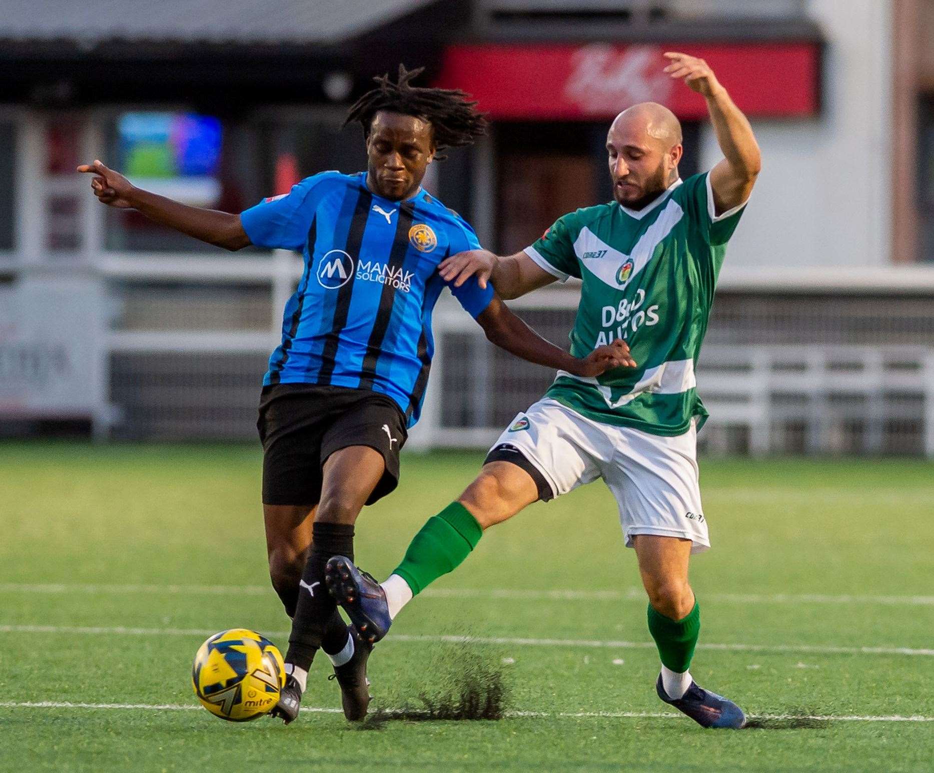 Adem Ramadan (right) in action for Ashford against Sevenoaks last August - he broke his leg less than a week later at Hythe.Picture: Ian Scammell